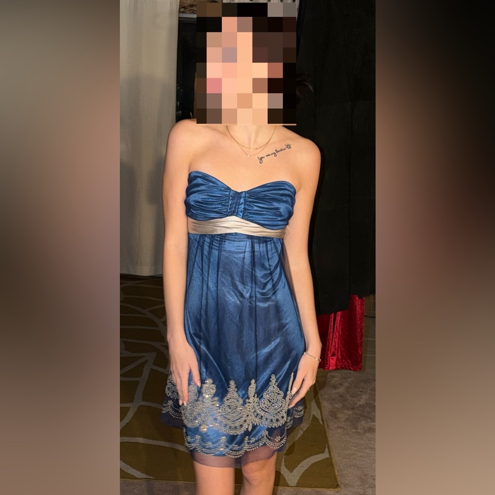 Fun deep blue with silver and white beading & gem work.  Evening Dress - size 2